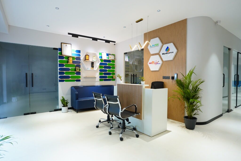 MIPA Industries corporate office reception area in Pune with MIPATEX, Promagic, and MipaEssence branding.